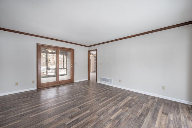 unfurnished room featuring ornamental molding and dark hardwood / wood-style flooring