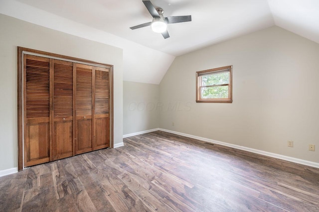 bonus room with dark wood-type flooring, ceiling fan, and lofted ceiling