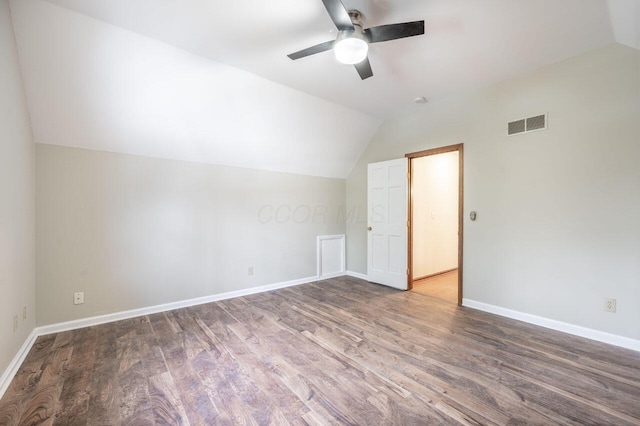 additional living space featuring ceiling fan, lofted ceiling, and dark hardwood / wood-style flooring