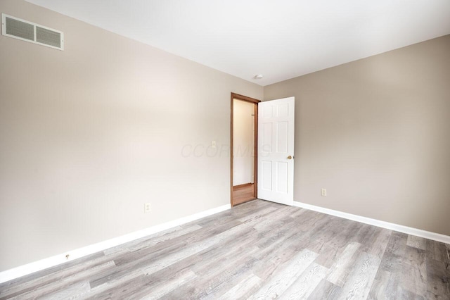 unfurnished room featuring light hardwood / wood-style floors