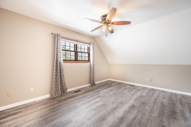 bonus room featuring hardwood / wood-style flooring, ceiling fan, and lofted ceiling