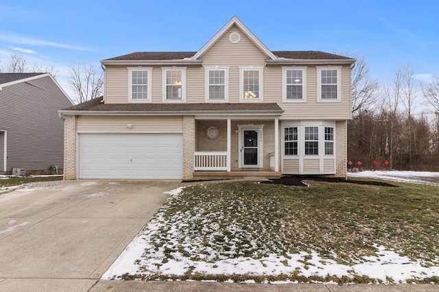 view of front of house featuring a porch, a garage, and a front yard