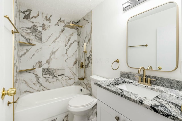 full bathroom featuring tiled shower / bath, vanity, a textured ceiling, and toilet