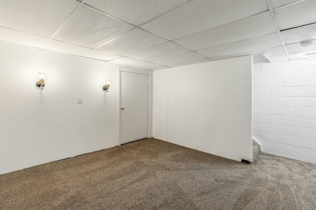 basement with carpet flooring and a drop ceiling