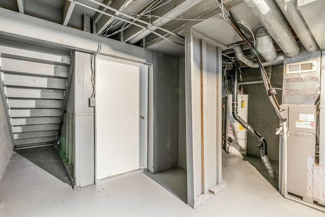 basement with heating unit and water heater