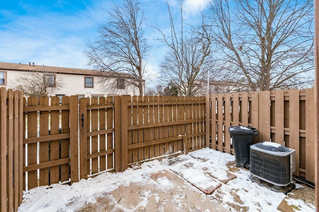 snow covered patio with central AC