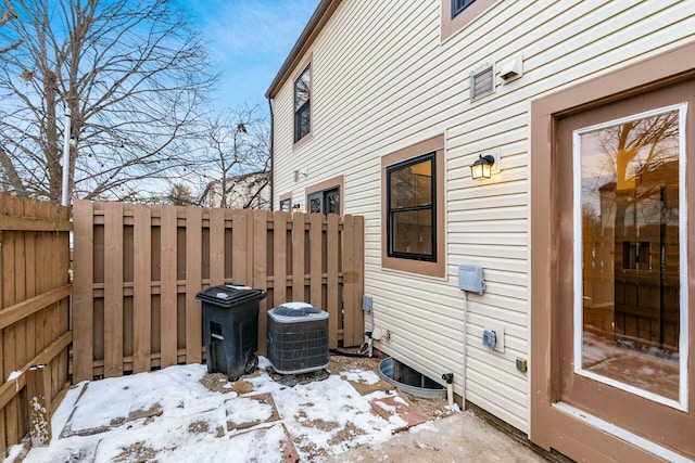 snow covered patio with central AC