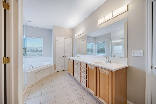 bathroom with tile patterned flooring, vanity, and independent shower and bath