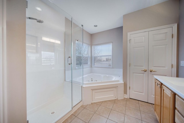 bathroom with tile patterned flooring, vanity, and independent shower and bath