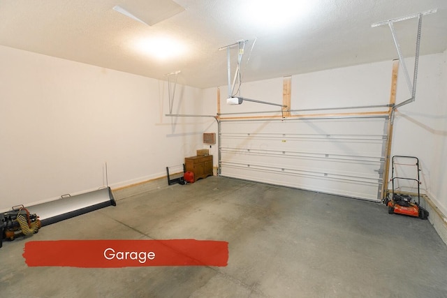 garage featuring a garage door opener