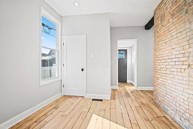 interior space featuring light hardwood / wood-style floors and a healthy amount of sunlight