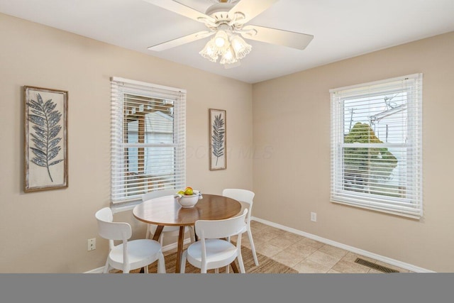 dining room featuring ceiling fan