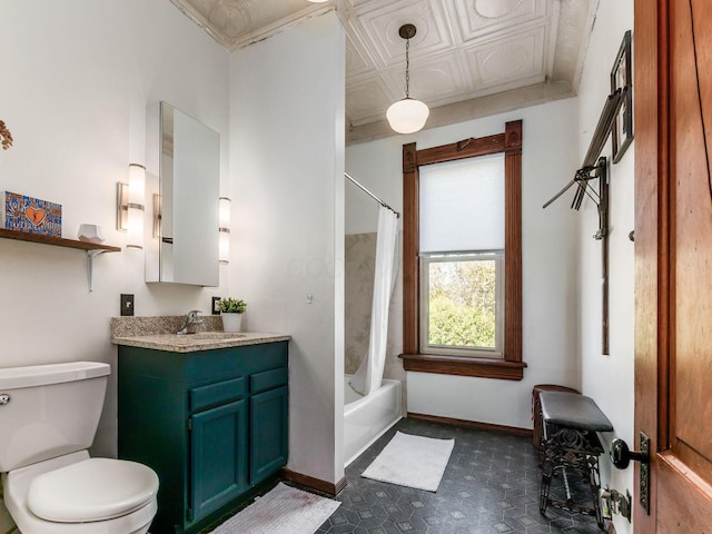 full bathroom with vanity, shower / bath combo with shower curtain, and toilet