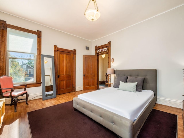 bedroom featuring wood-type flooring