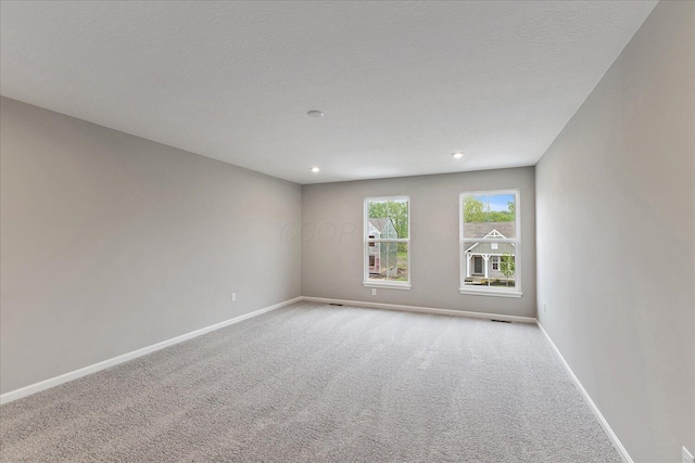 1208 Heathgate Way, Fairborn, OH 45324 - carpeted empty room featuring baseboards, recessed lighting, and a textured ceiling