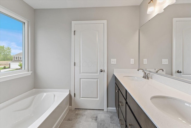 1208 Heathgate Way, Fairborn, OH 45324 - bathroom with a garden tub, double vanity, and baseboards