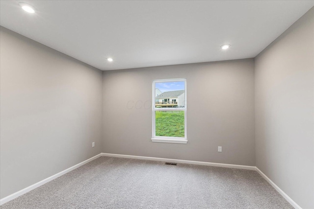 1208 Heathgate Way, Fairborn, OH 45324 - spare room with carpet floors, baseboards, and recessed lighting
