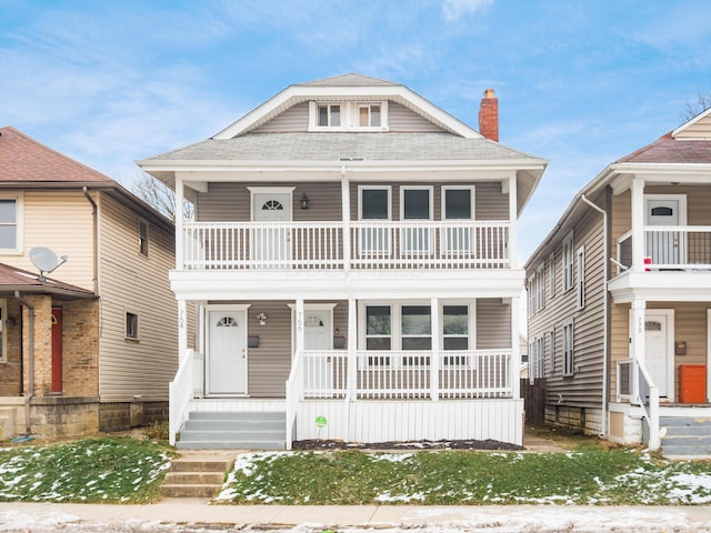 view of front of house with a balcony