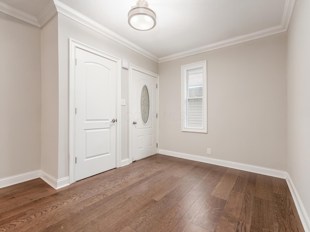 entryway with hardwood / wood-style floors and ornamental molding