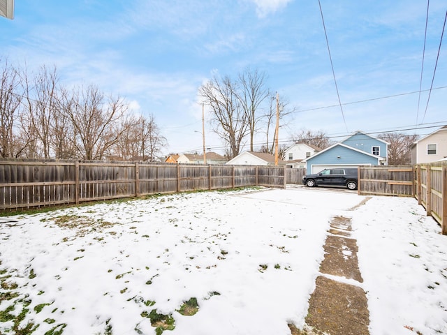 view of yard covered in snow