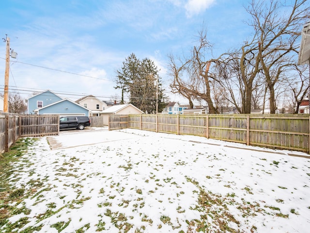 view of yard layered in snow