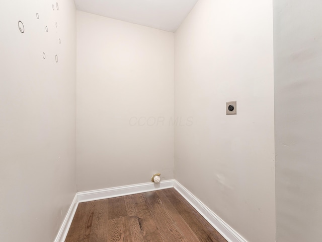 laundry area featuring electric dryer hookup and hardwood / wood-style flooring