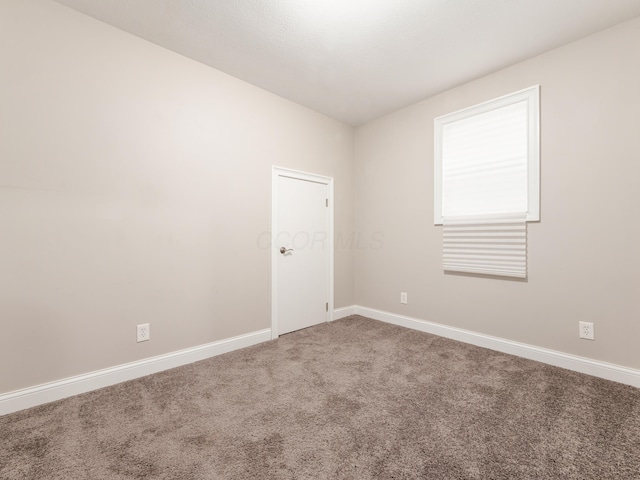 view of carpeted spare room