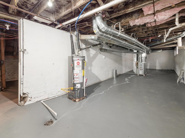 basement featuring heating unit and gas water heater