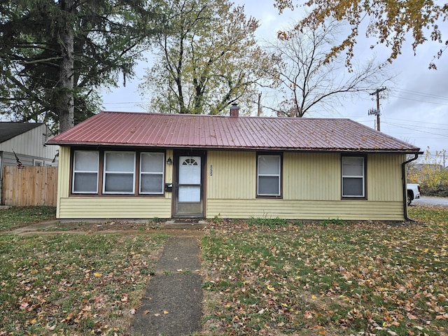 ranch-style home with a front yard