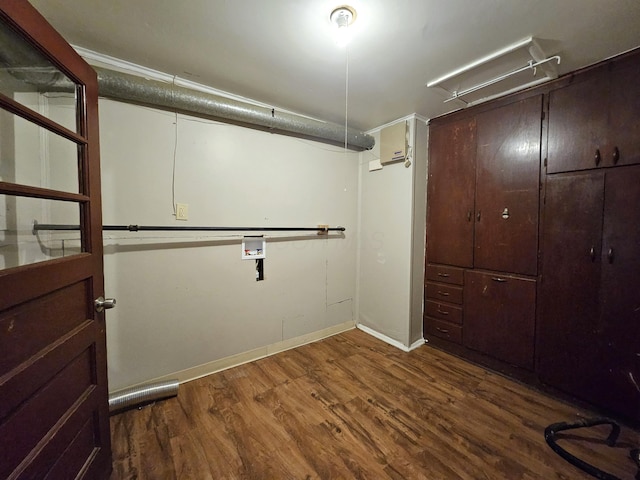 basement featuring dark hardwood / wood-style floors