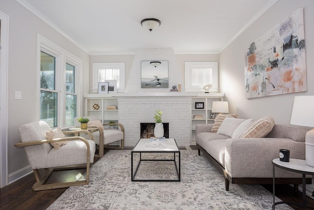 living room with ornamental molding, hardwood / wood-style floors, and a brick fireplace