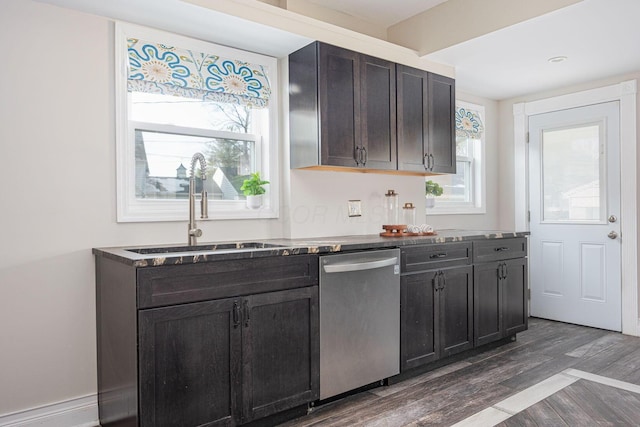 kitchen featuring dishwasher, dark brown cabinets, sink, and dark wood-type flooring