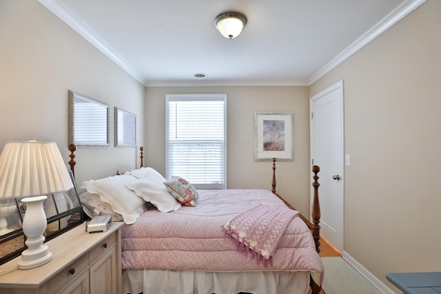 carpeted bedroom with multiple windows and ornamental molding