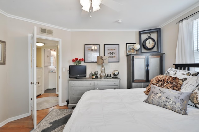 bedroom with crown molding, light hardwood / wood-style flooring, and ceiling fan