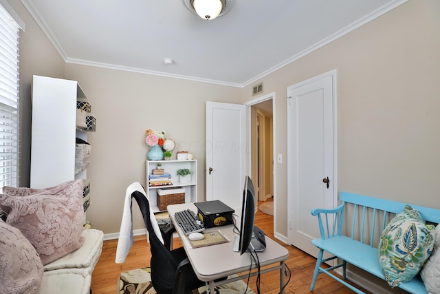 home office with wood-type flooring and crown molding