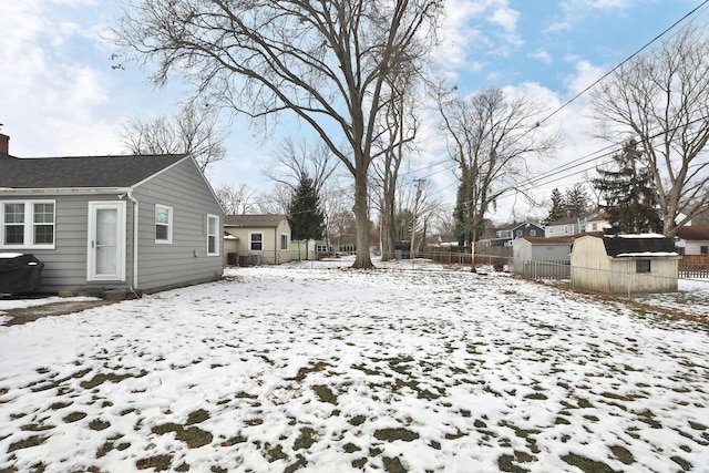 view of yard covered in snow