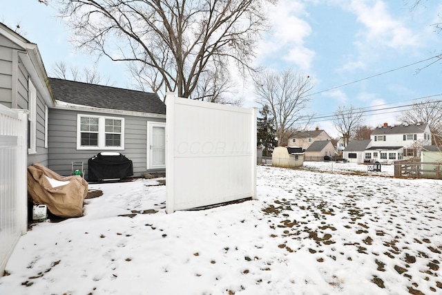 view of yard covered in snow