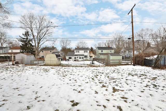 view of yard layered in snow