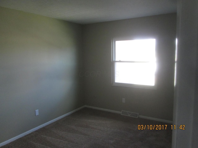 view of carpeted spare room