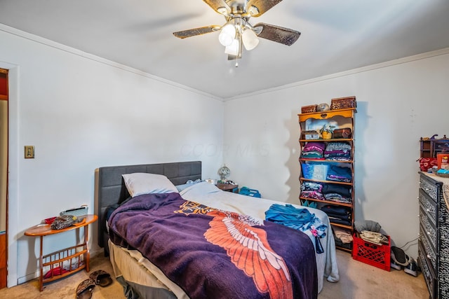 bedroom with ceiling fan, ornamental molding, and light colored carpet