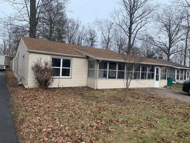 exterior space featuring a sunroom