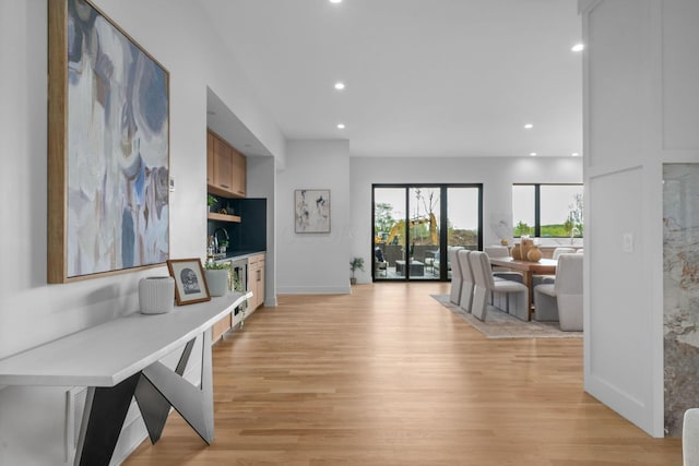 interior space featuring light wood-style floors, baseboards, and recessed lighting