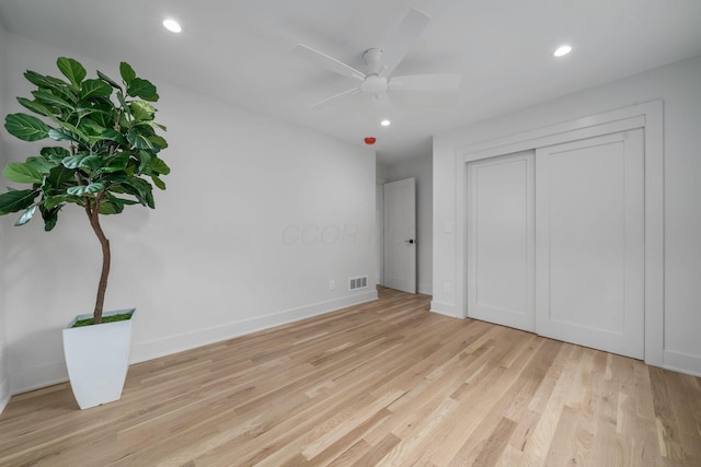 unfurnished bedroom featuring recessed lighting, light wood-style floors, and visible vents