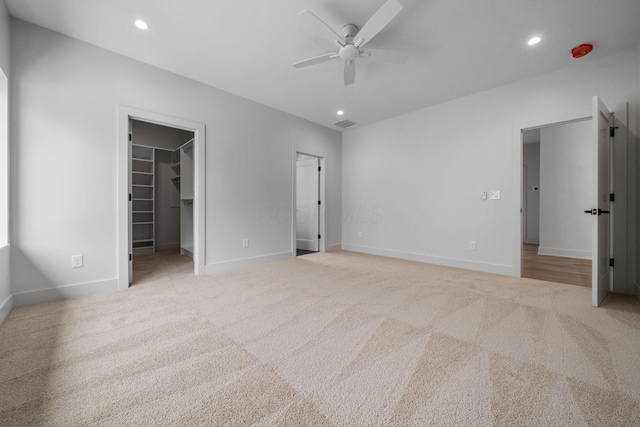 unfurnished bedroom with carpet, baseboards, and recessed lighting