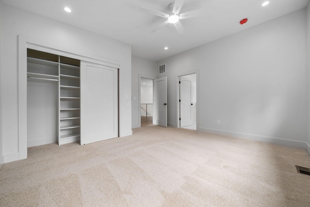 unfurnished bedroom featuring carpet flooring, visible vents, and recessed lighting