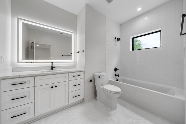 bathroom with toilet, vanity, tile patterned floors, shower / bath combination, and baseboards