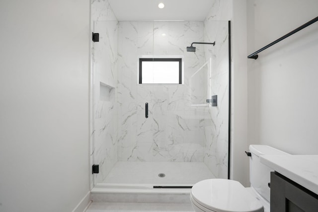 full bathroom with toilet, baseboards, vanity, and a marble finish shower