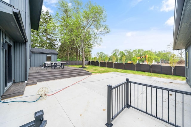 view of patio / terrace with a deck and a fenced backyard
