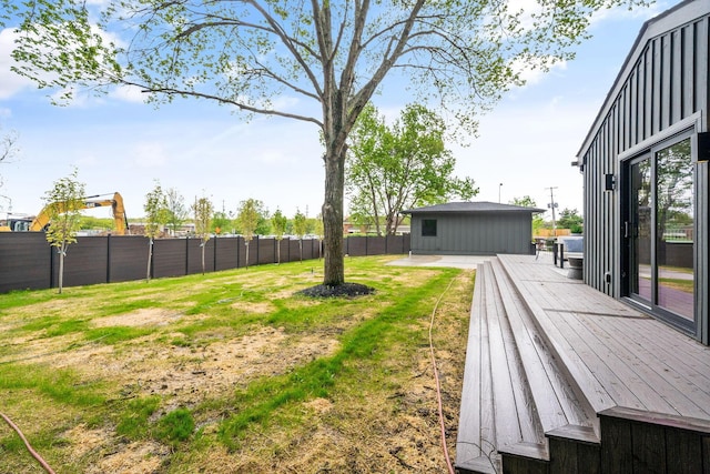 view of yard featuring a wooden deck and fence