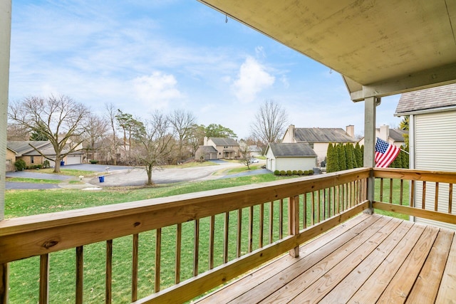 wooden terrace with a yard